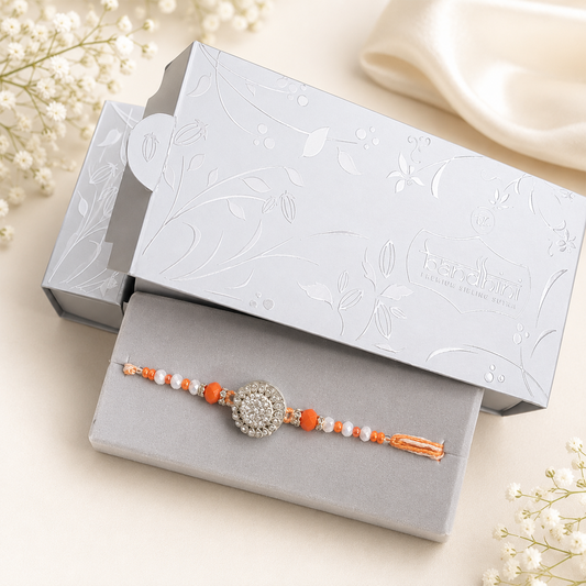 Elegant Crystal Floral Rakhi with Orange & White Beads
