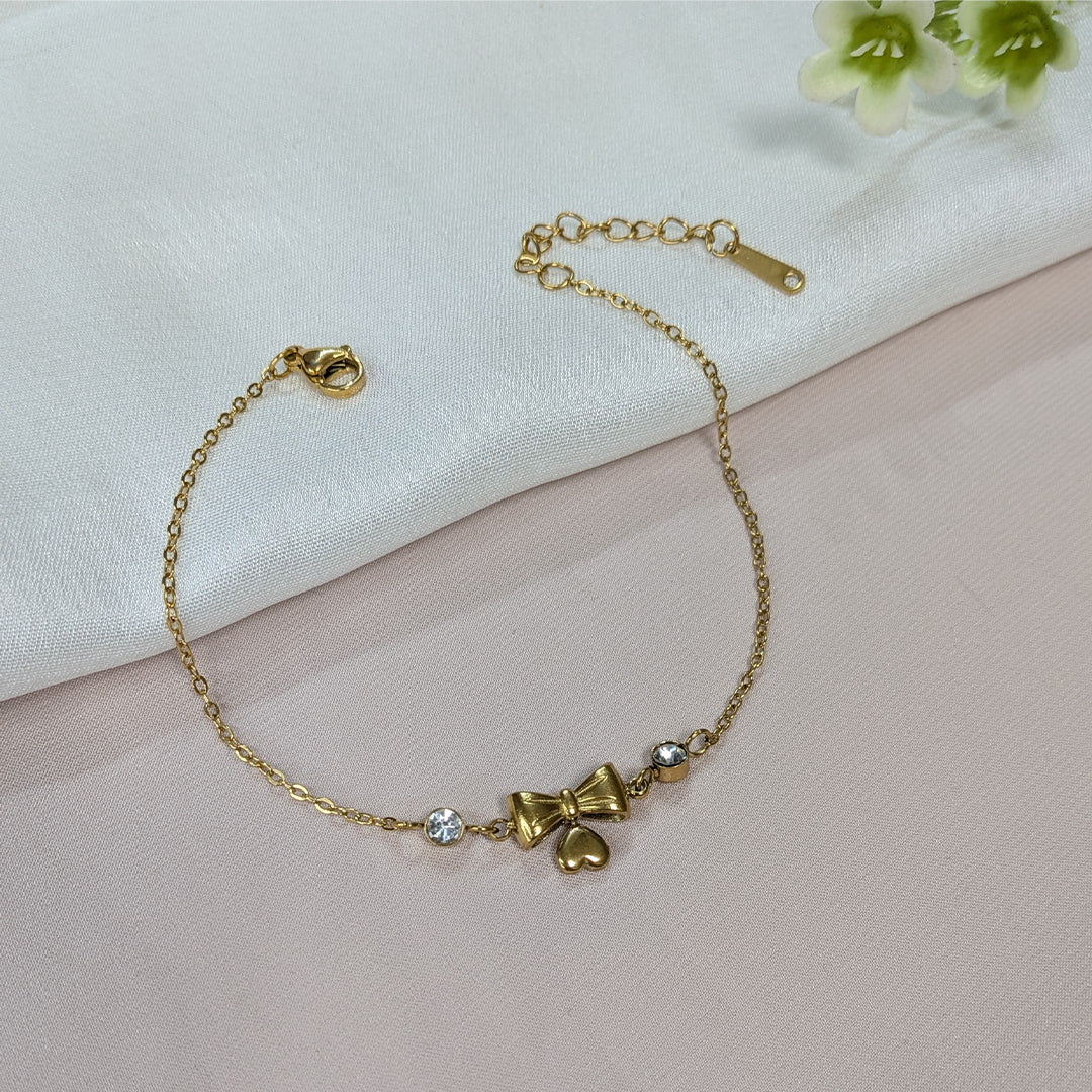 Gold Finish Crystal Bow & Heart Charm Bracelet For Girls & Women (Anti-Tarnish)