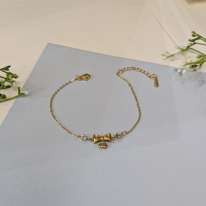Gold Finish Crystal Bow & Heart Charm Bracelet For Girls & Women (Anti-Tarnish)
