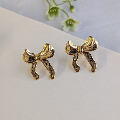 Gold Plated Glossy Ribbon Bow Stud Earrings For Girls & Women (Anti Tarnish)