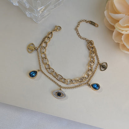 Gold Tone Dual Layer Link & Chain Bracelet with Blue Teardrop and Evil Eye Charms For Girls & Women