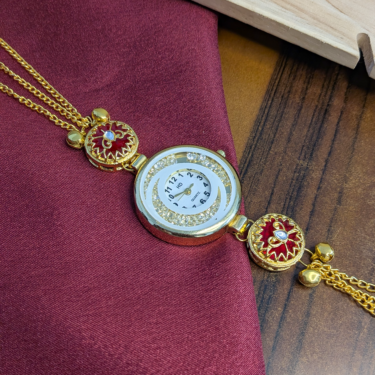 Women’s Gold-Tone Kashmiri Watch with Red Stone Design
