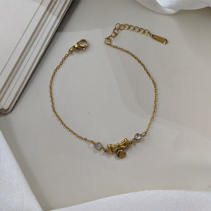 Gold Finish Crystal Bow & Heart Charm Bracelet For Girls & Women (Anti-Tarnish)