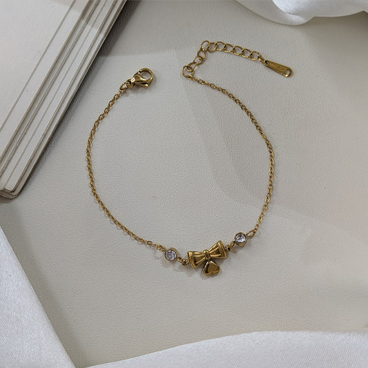 Gold Finish Crystal Bow & Heart Charm Bracelet For Girls & Women (Anti-Tarnish)