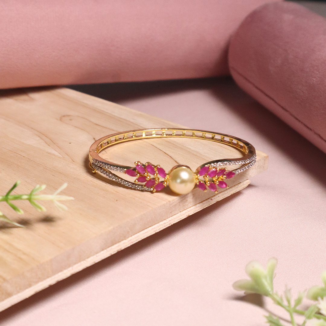 Gold Plated American Diamond With Pink Stone and White Pearl Bracelet