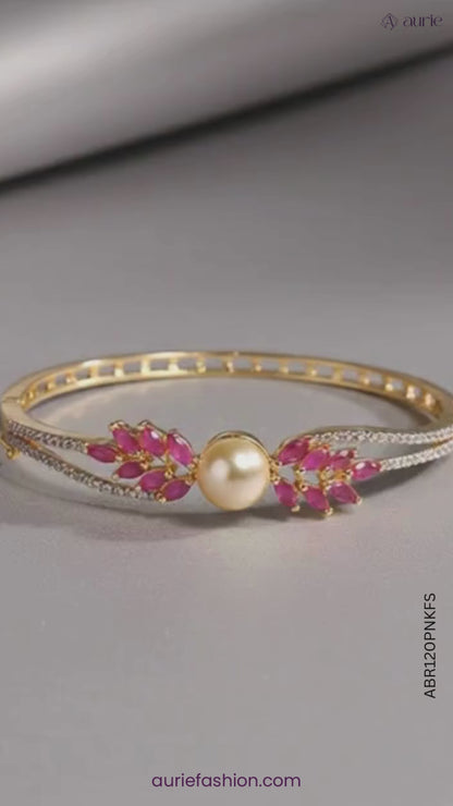 Gold Plated American Diamond With Pink Stone and White Pearl Bracelet